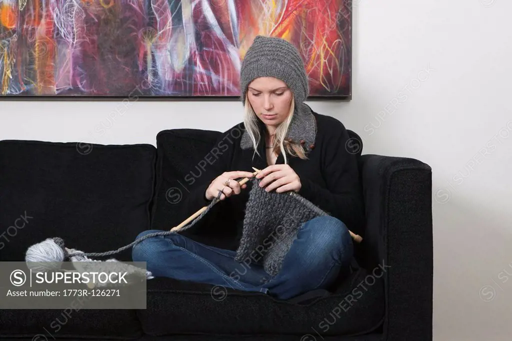 Woman knitting scarf