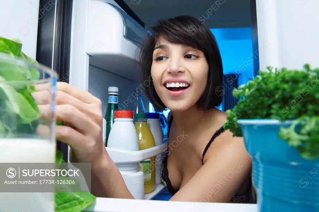 Woman looking into the fridge