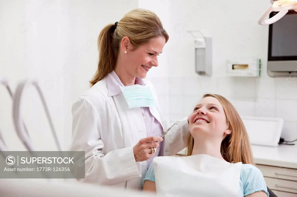 Dentist with patient in surgery