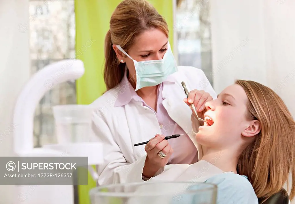 Dentist with patient in surgery