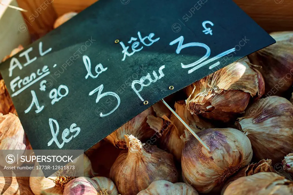 Fresh garlic on French market stall, close-up