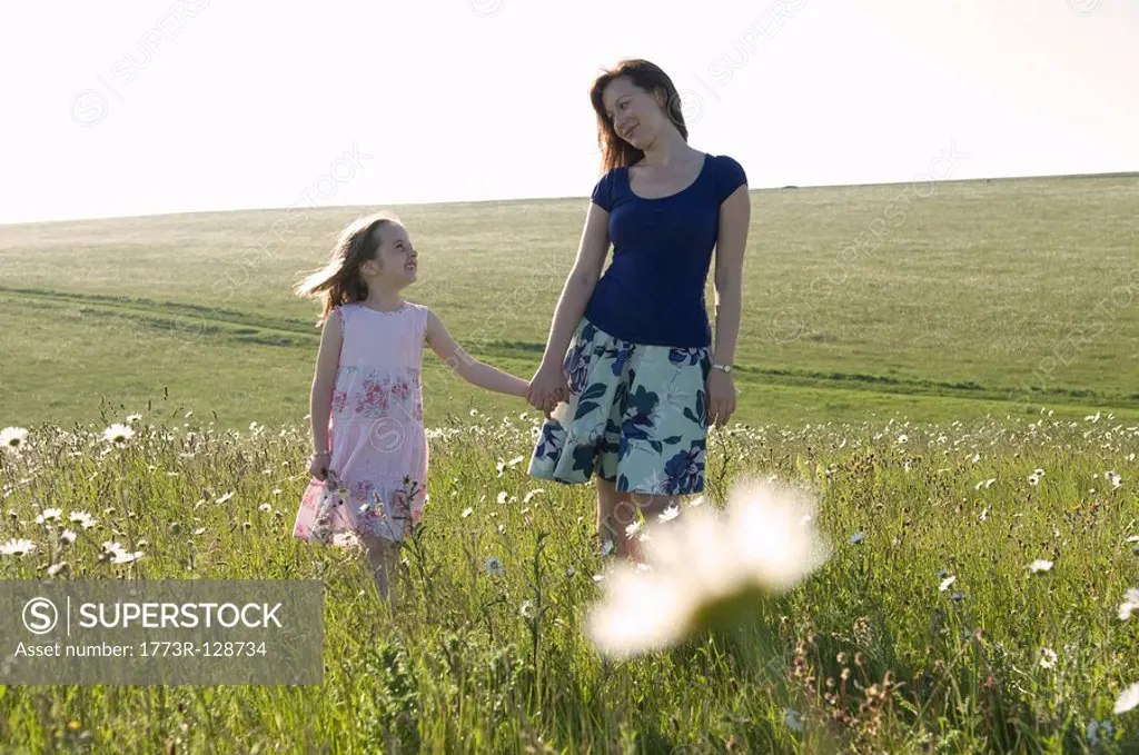 Woman and child in sunny meadow