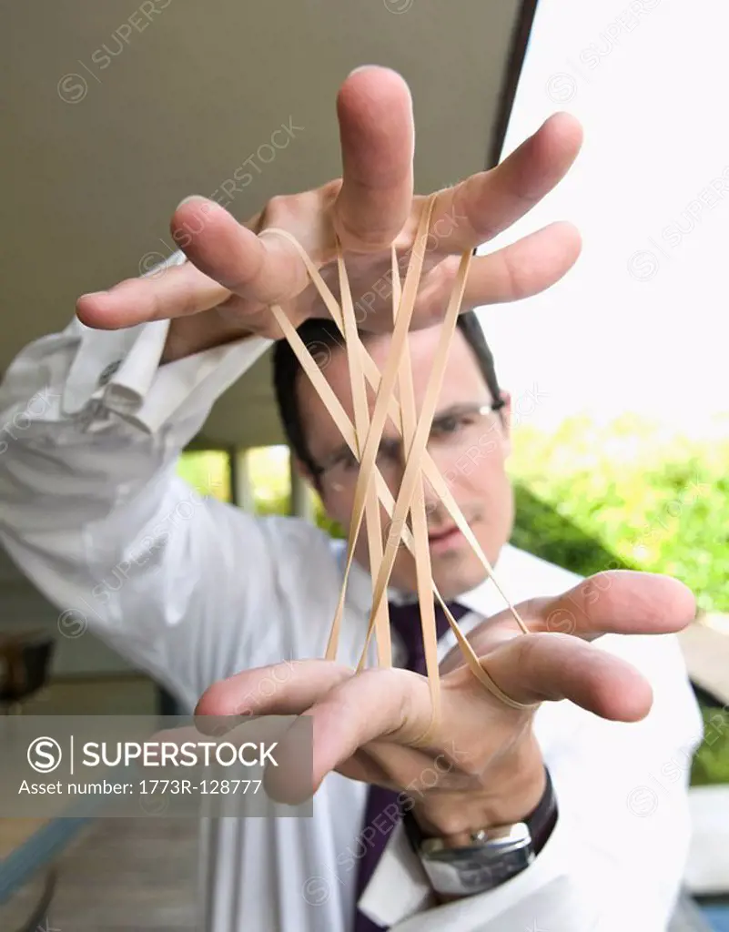 Man stretches elastic bands