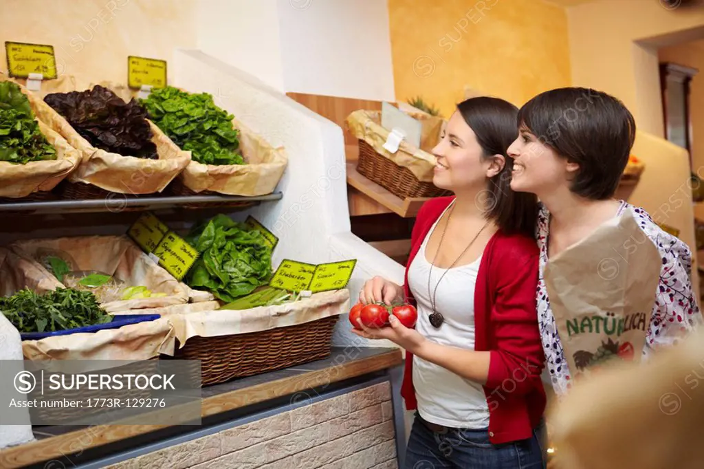 Young people buying fruits and vegetable