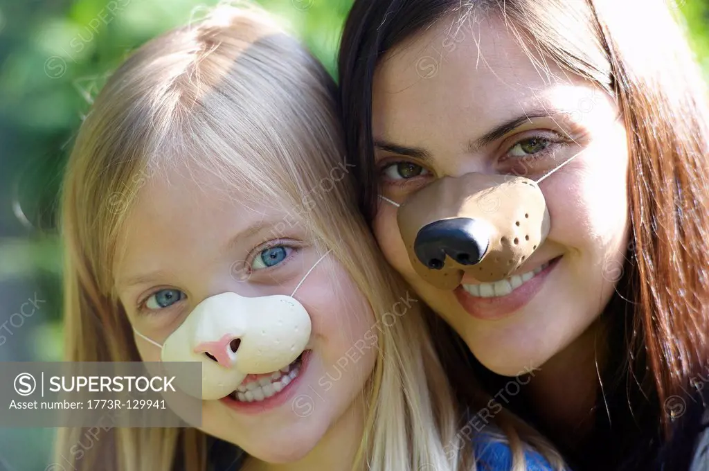 Mother and daughter wearing masks