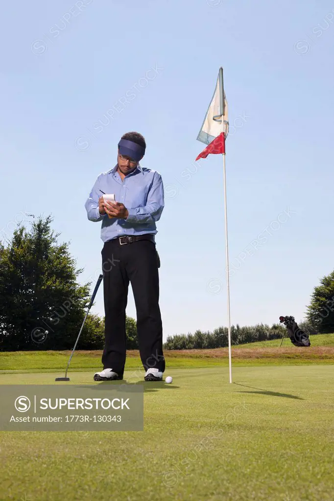 Writing down the score on a golf course