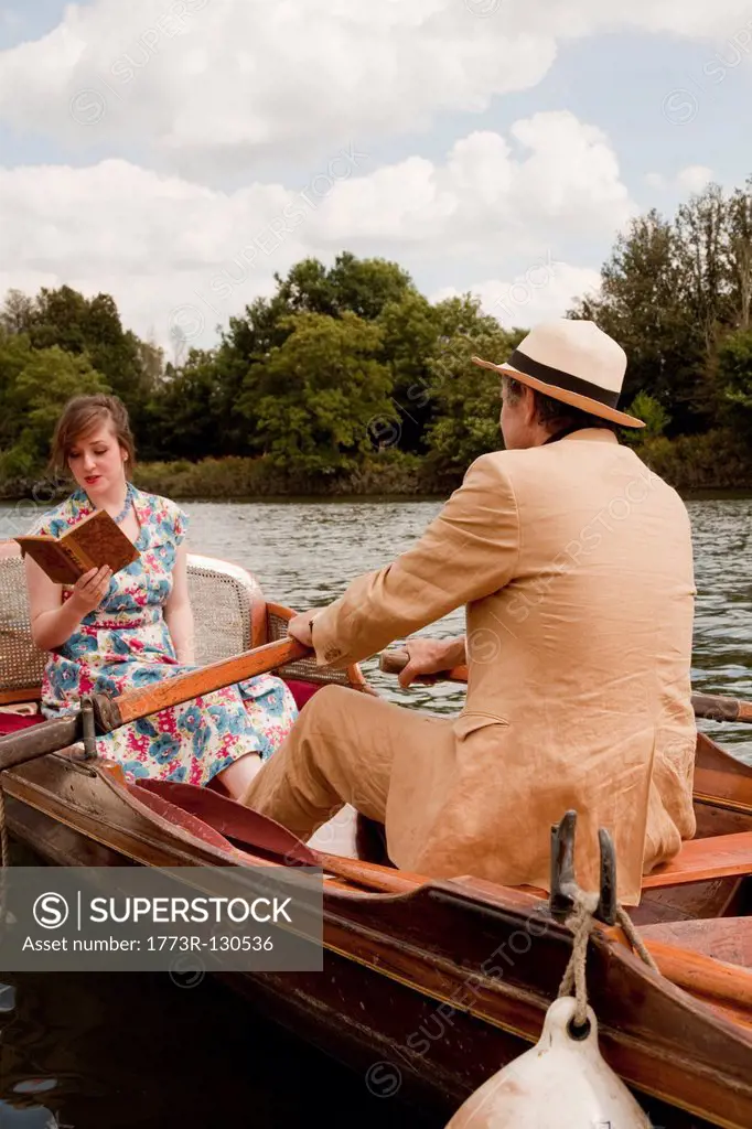 Father and daughter on a vintage boat