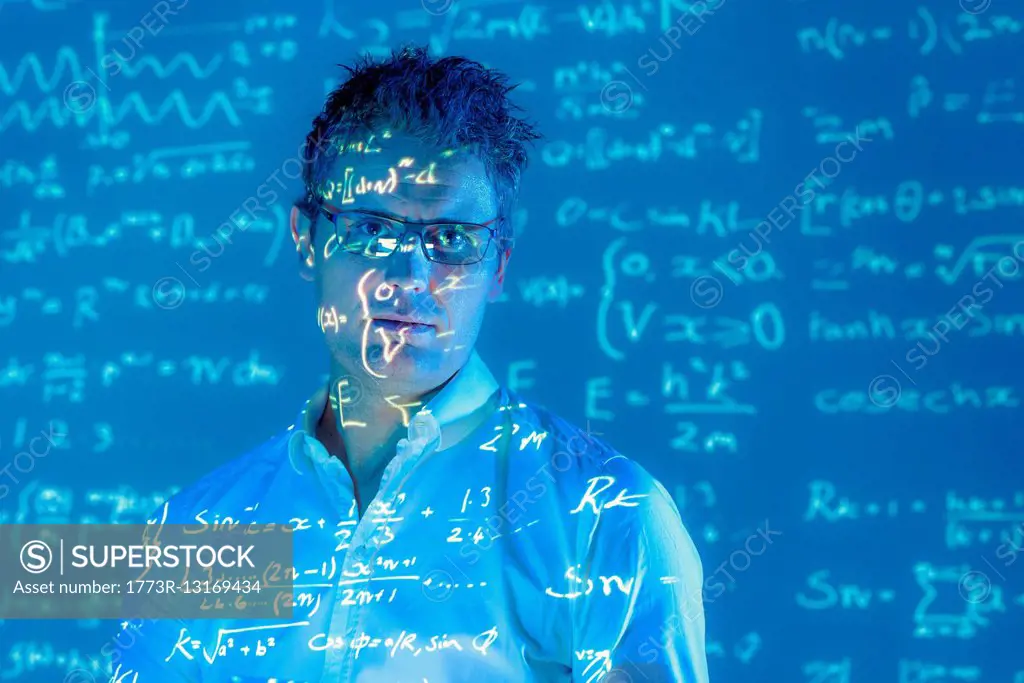 Portrait of scientist with projected mathematical data
