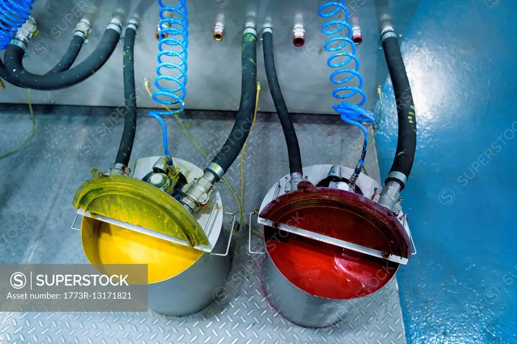 Buckets of ink in food packaging printing factory