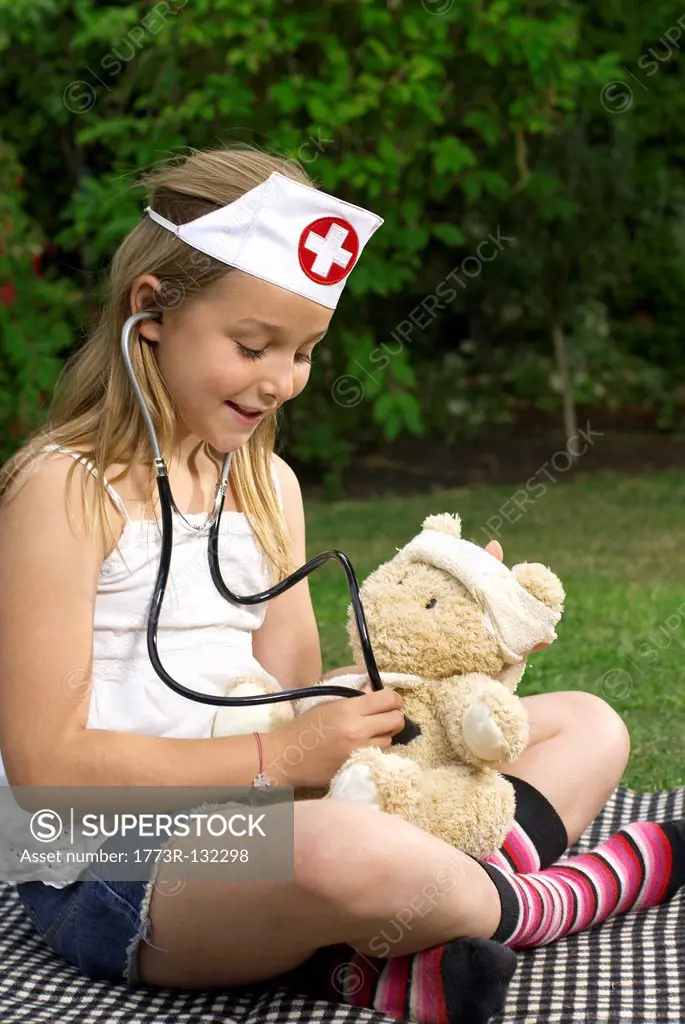 Young girl and teddy bear