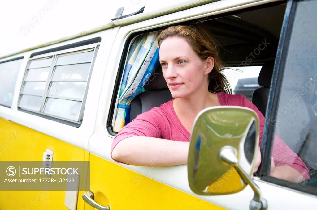 Women looks out of camper van