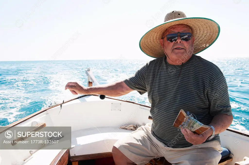 Fisherman at sea in fishing boat