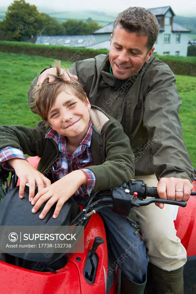 Father and son on quad bike