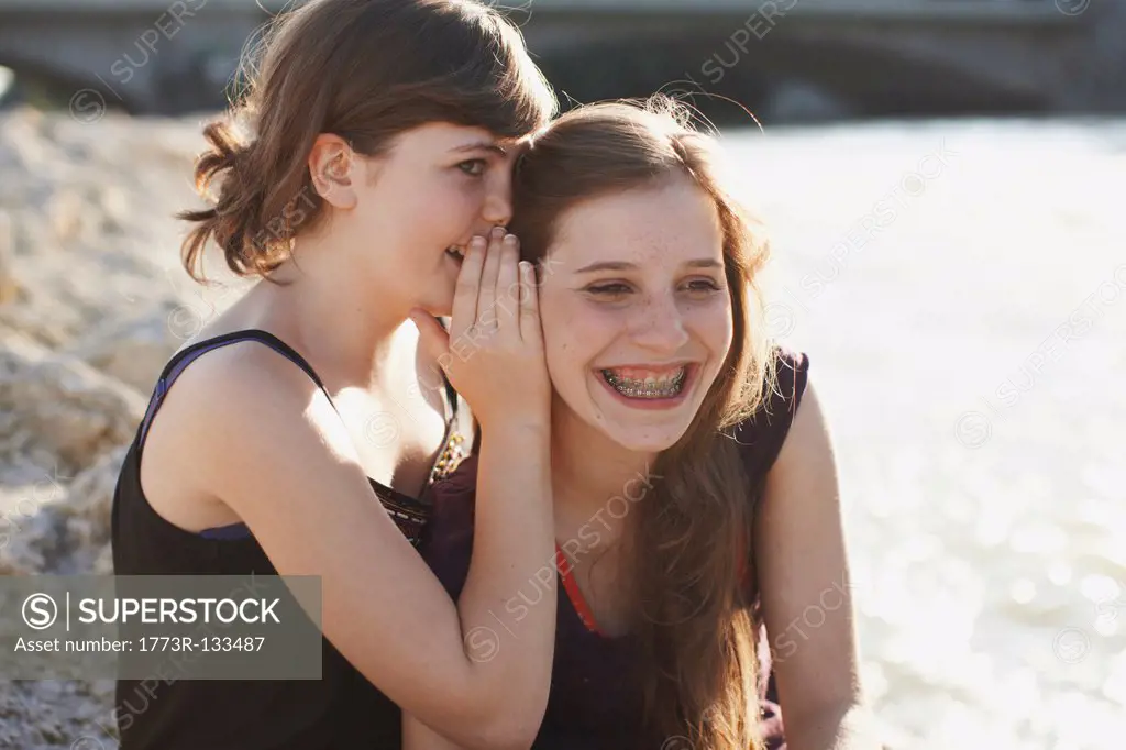 2 girls having fun together in a park