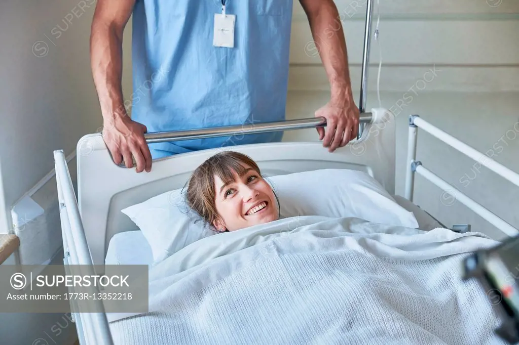 Patient in hospital bed smiling