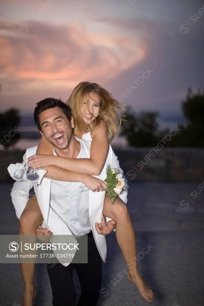 Man carrying his bride