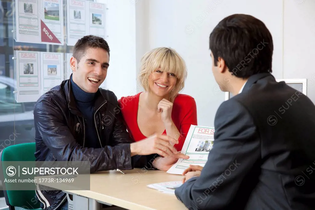 Couple visiting estate agents office
