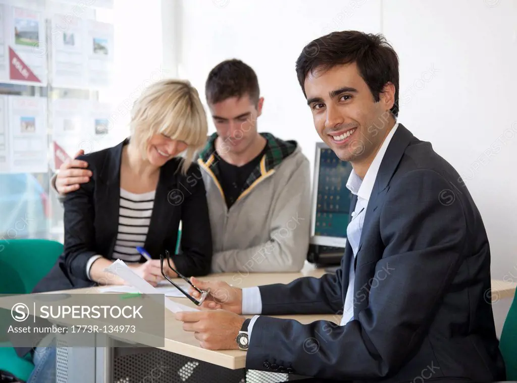 Couple visiting estate agents office