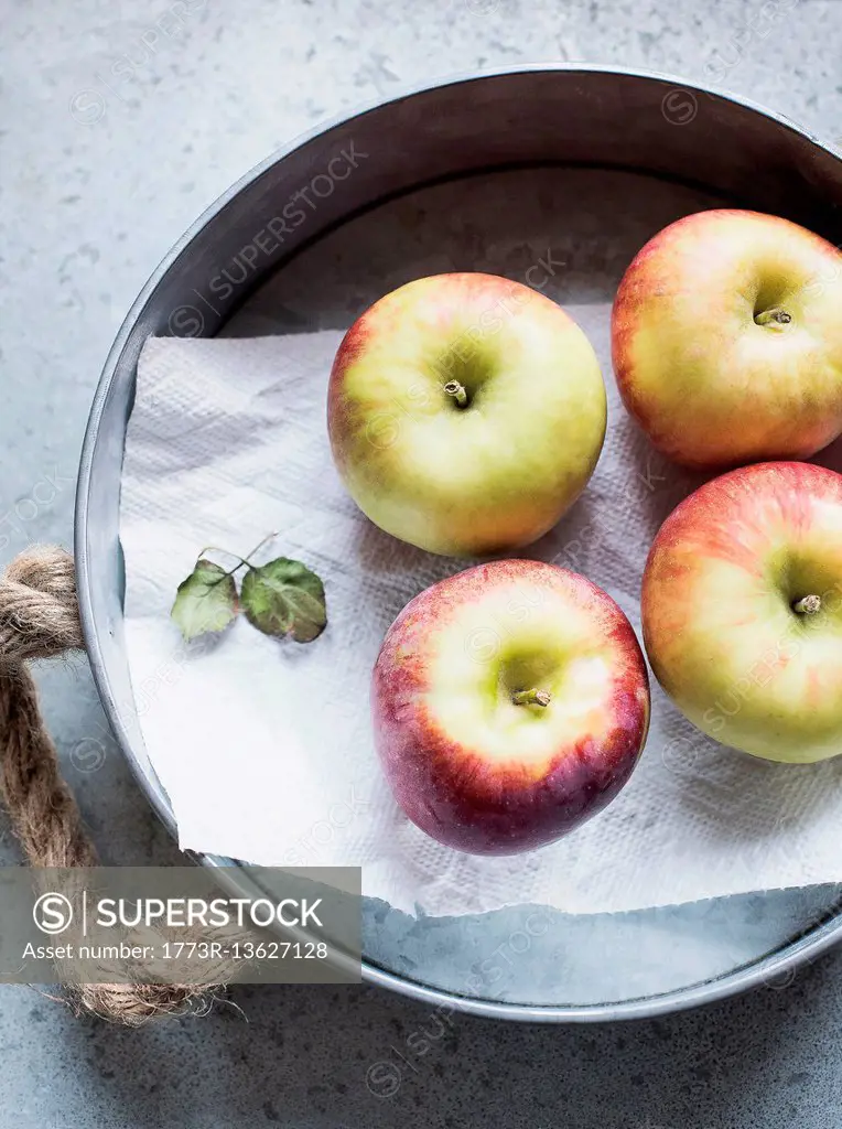Fresh Honeycrisp apples on metal tray