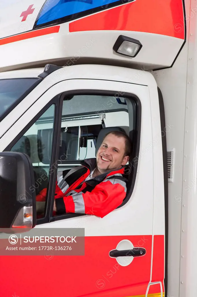 Ambulance man in coach, smiling