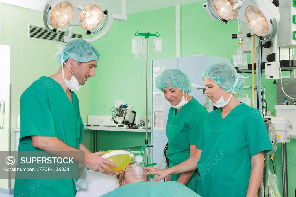 Medical team ventilating patient