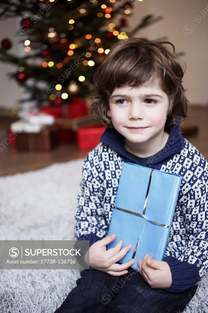 Boy holding gift