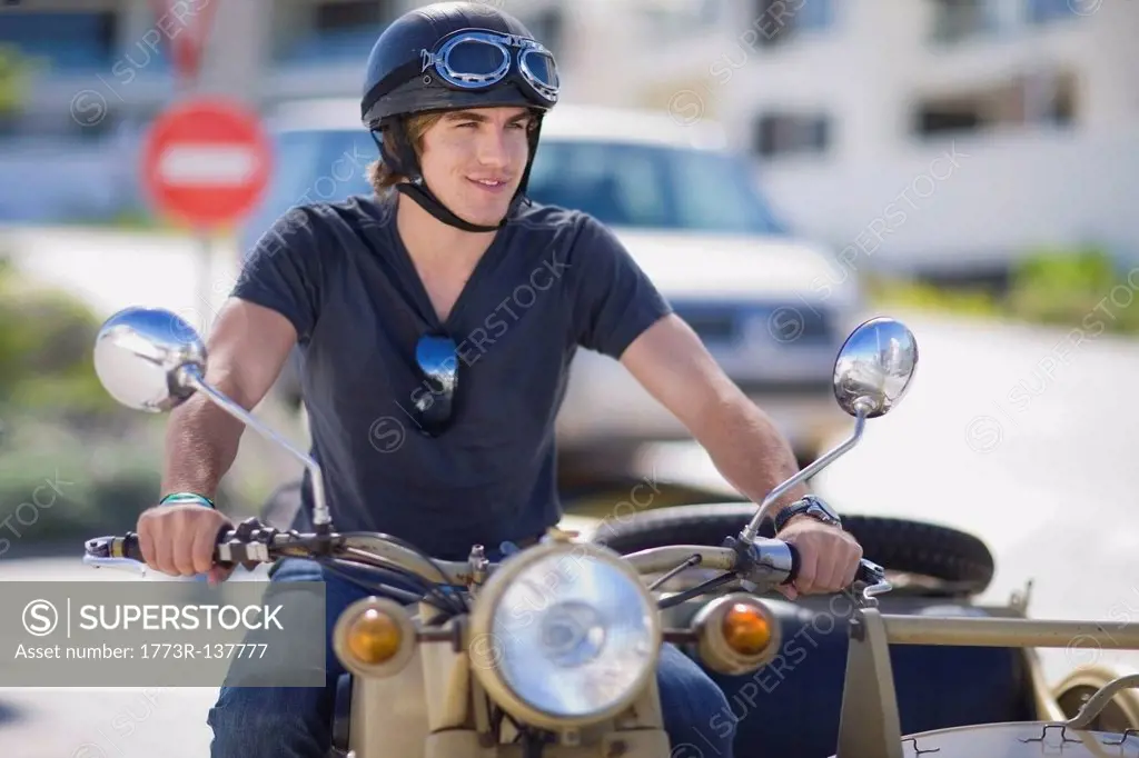 Young man riding a motorbike
