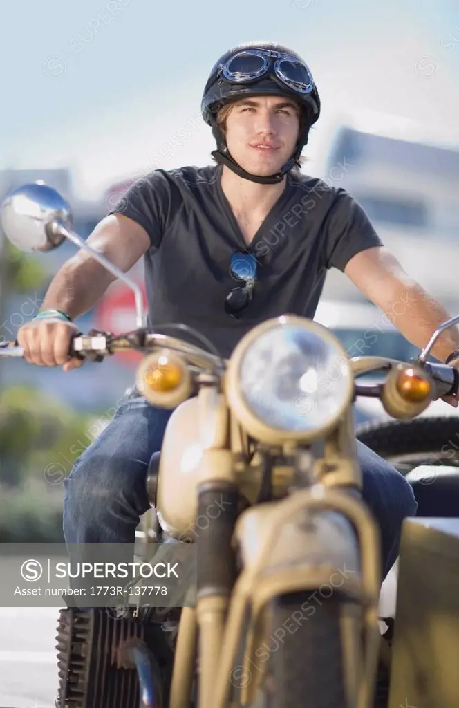 Young man riding a motorbike