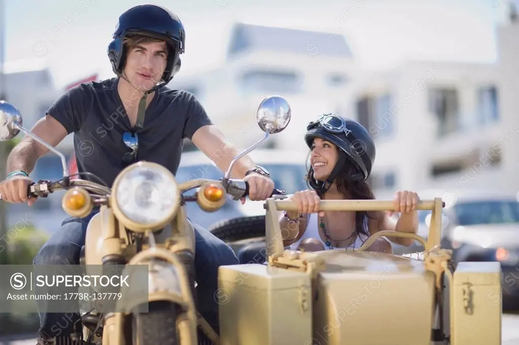 Couple riding a motorbike