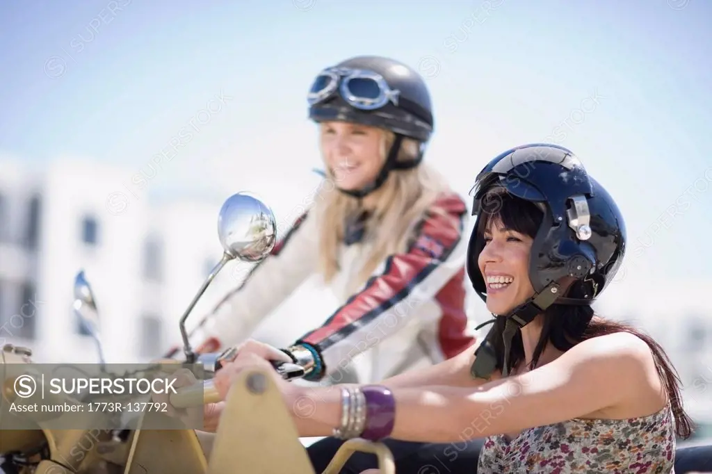 Women riding on a motorbike