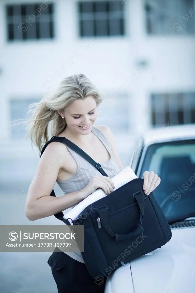 Woman unpacking her notebook