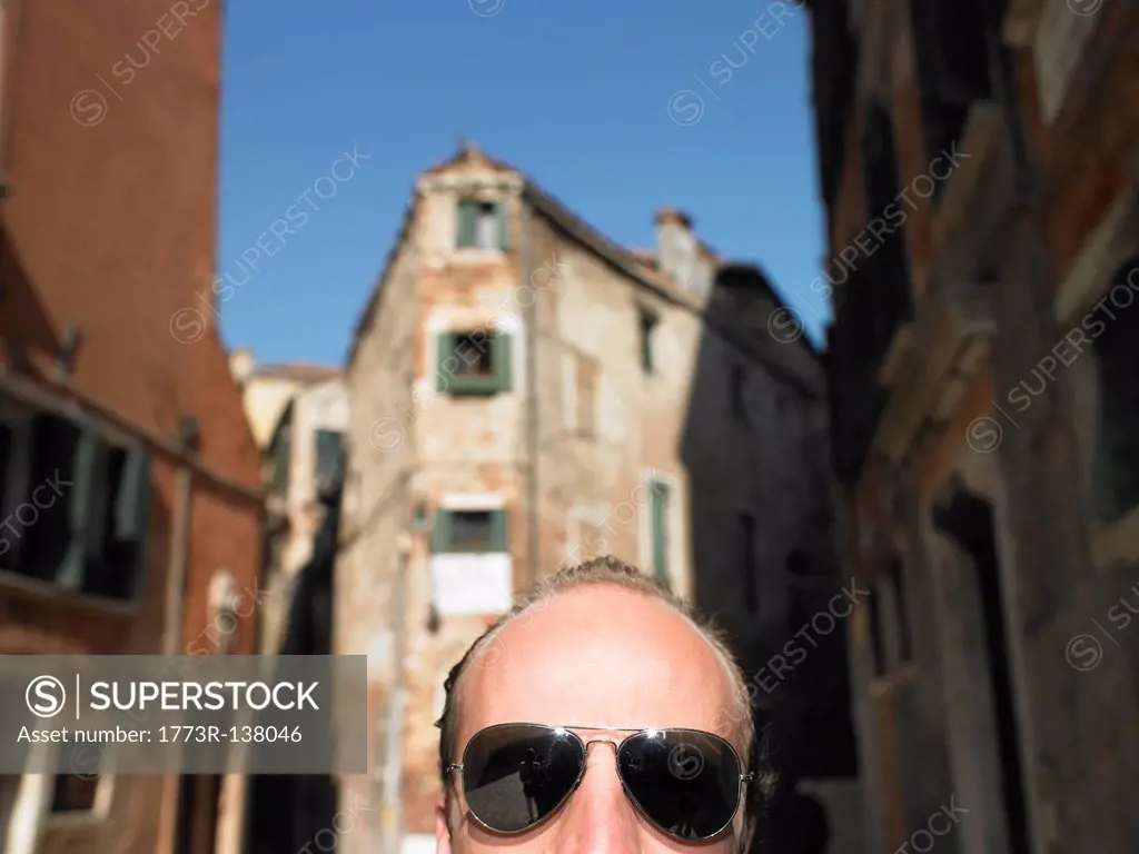 Front head of a man wearing sunglasses