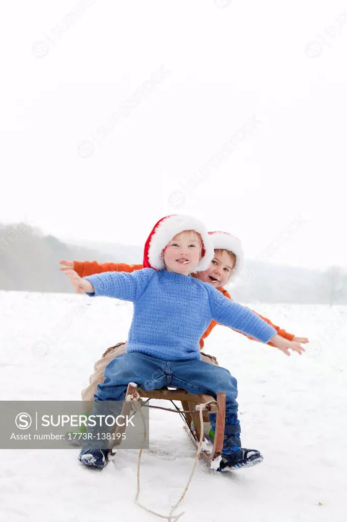 Two boys on a sledge
