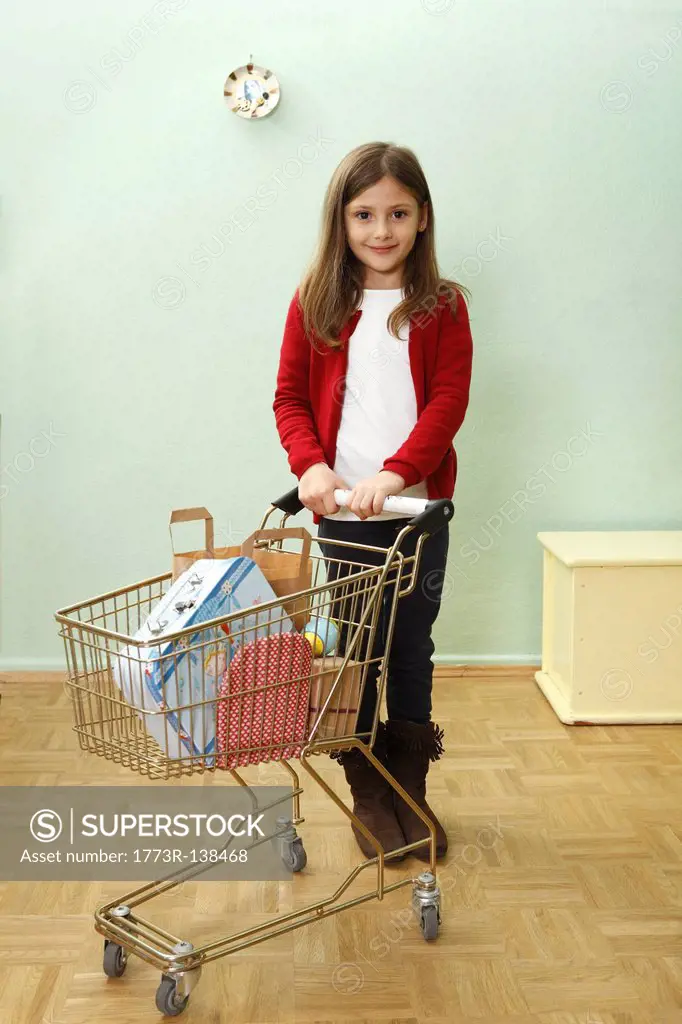 young girl with shopping trolly
