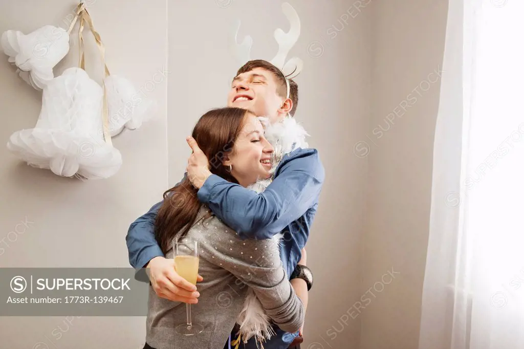 Man embracing girlfriend