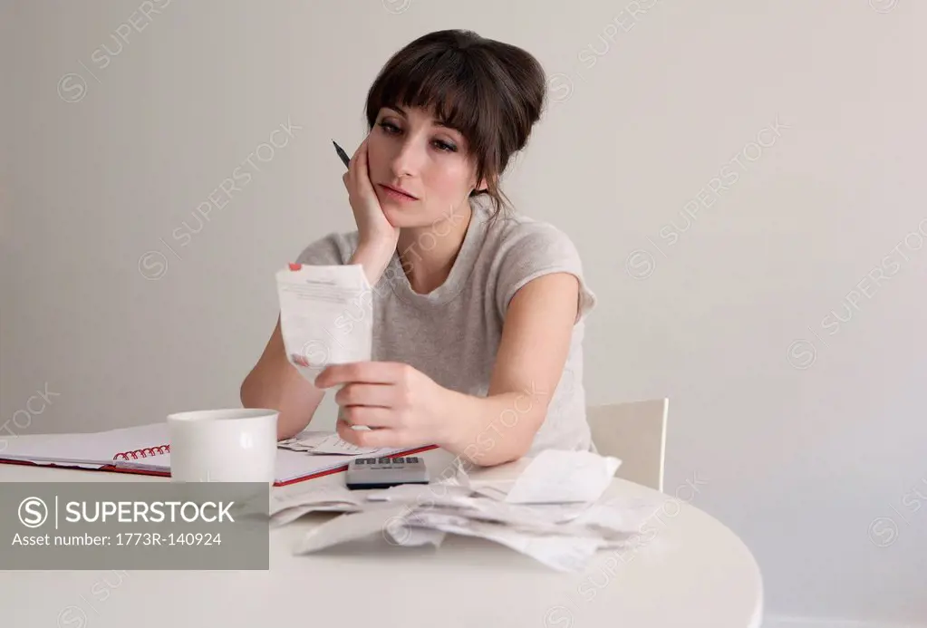 Woman reviewing receipts