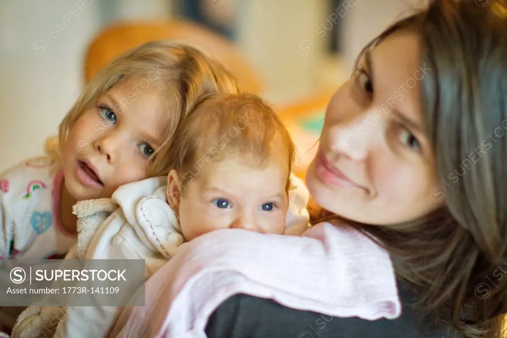 Woman smiling with daughters