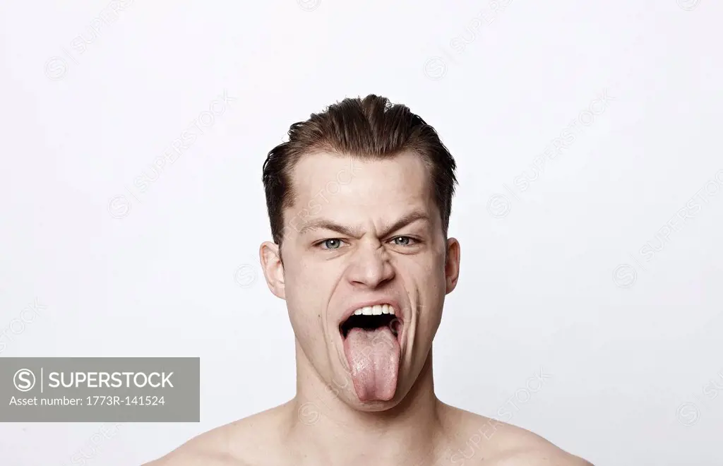 Nude man making a funny face