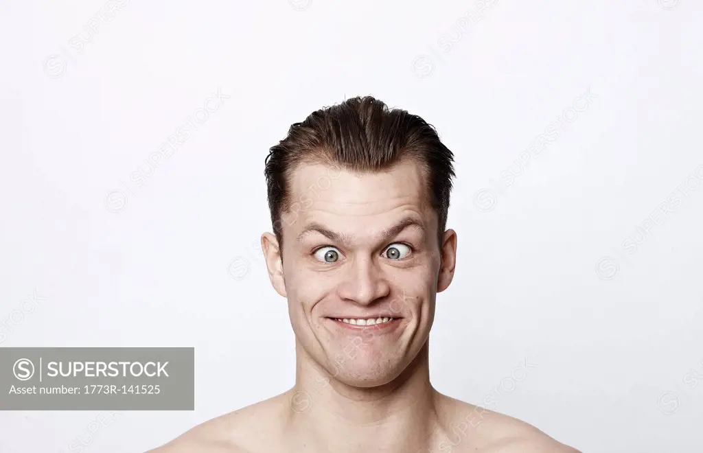 Nude man making a funny face