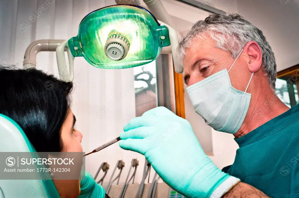 Dentist working on patient in office