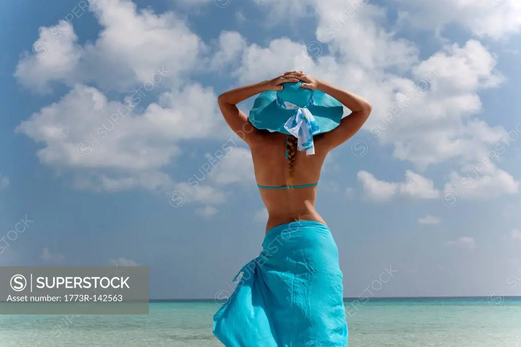 Woman standing on tropical beach