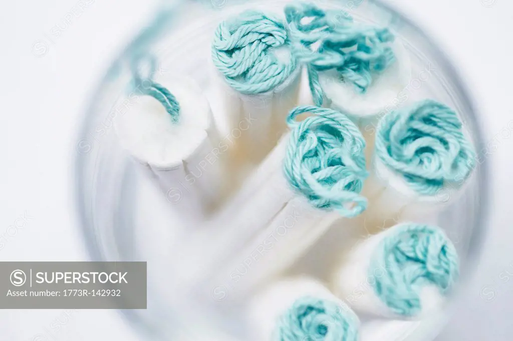 Close up of tampons in glass