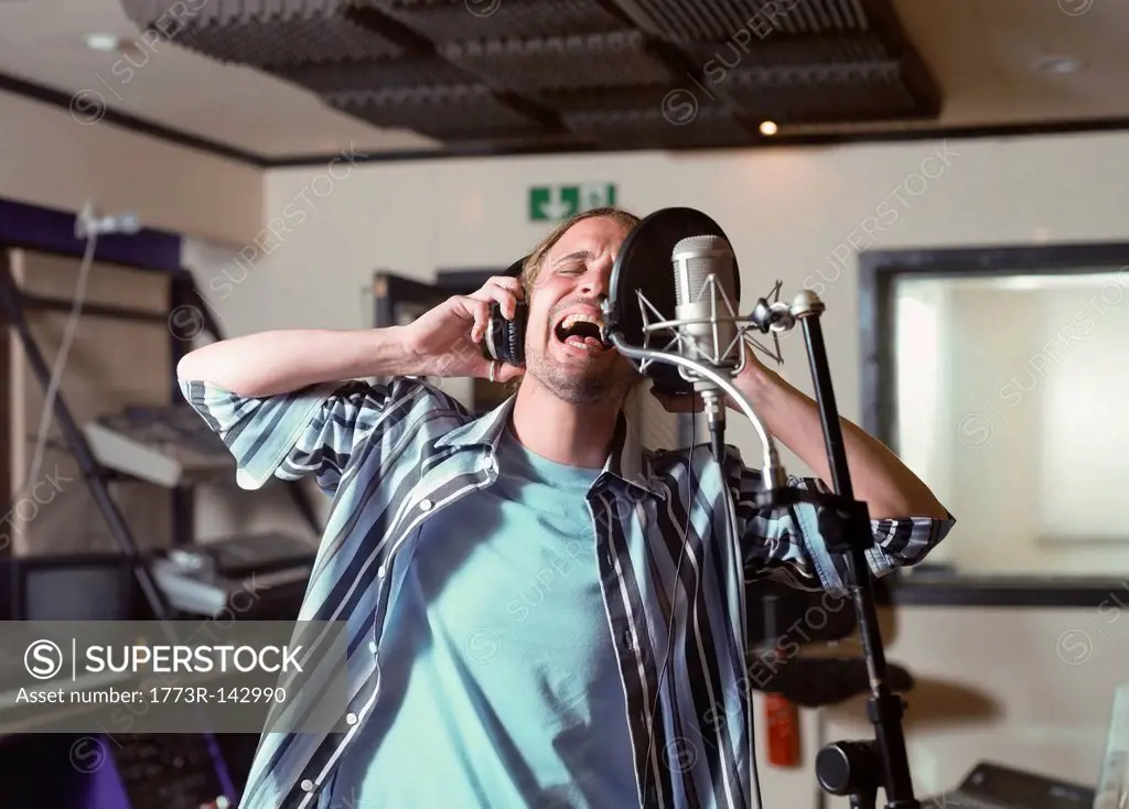 Man singing in recording studio