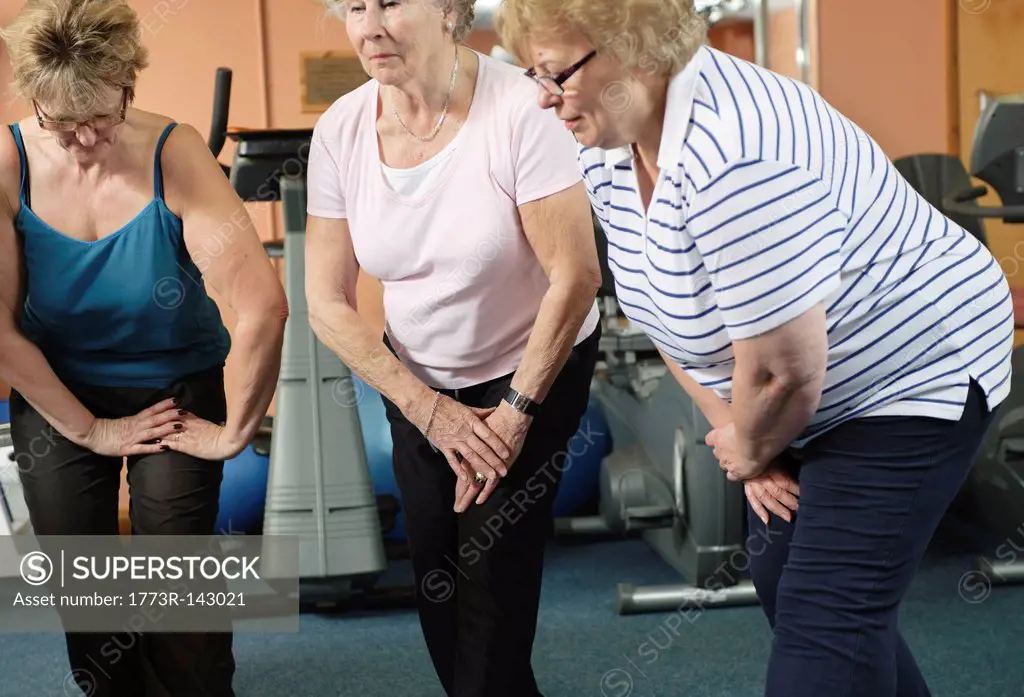 Older women stretching in gym