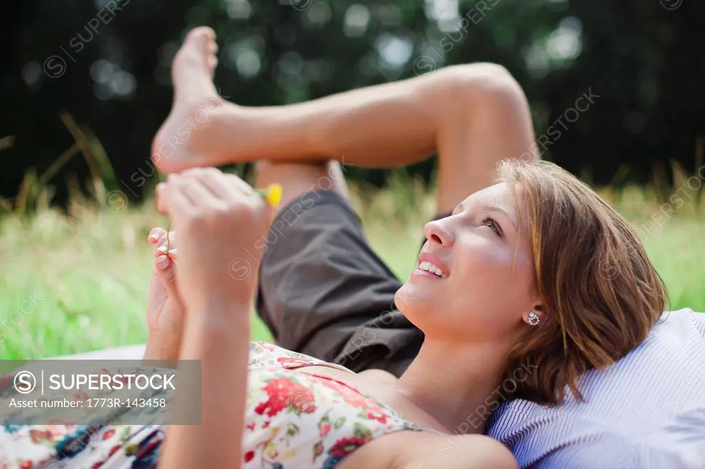 Couple laying in field together