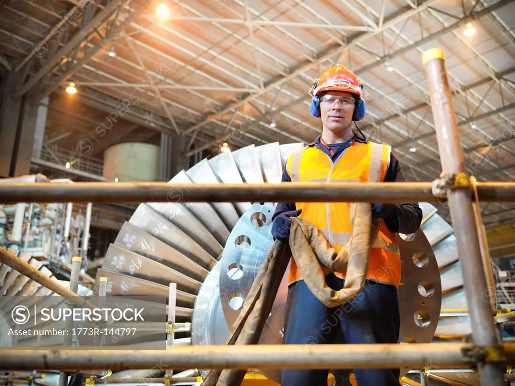 Worker with turbine in power station