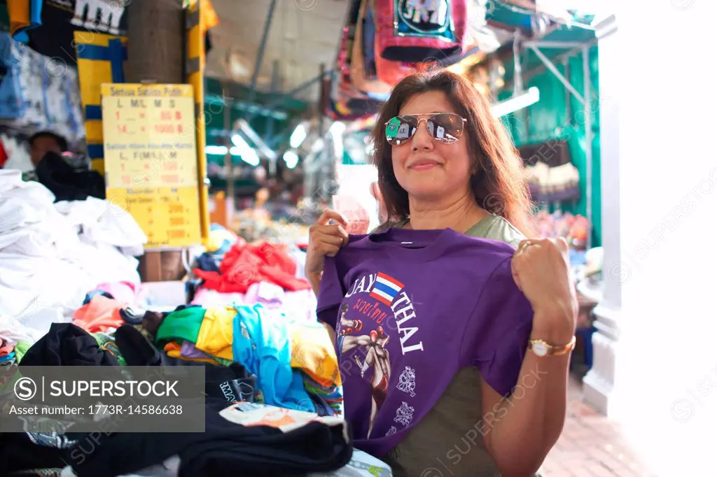 Woman looking at souvenirs on market stall, Bangkok, Krung Thep, Thailand, Asia