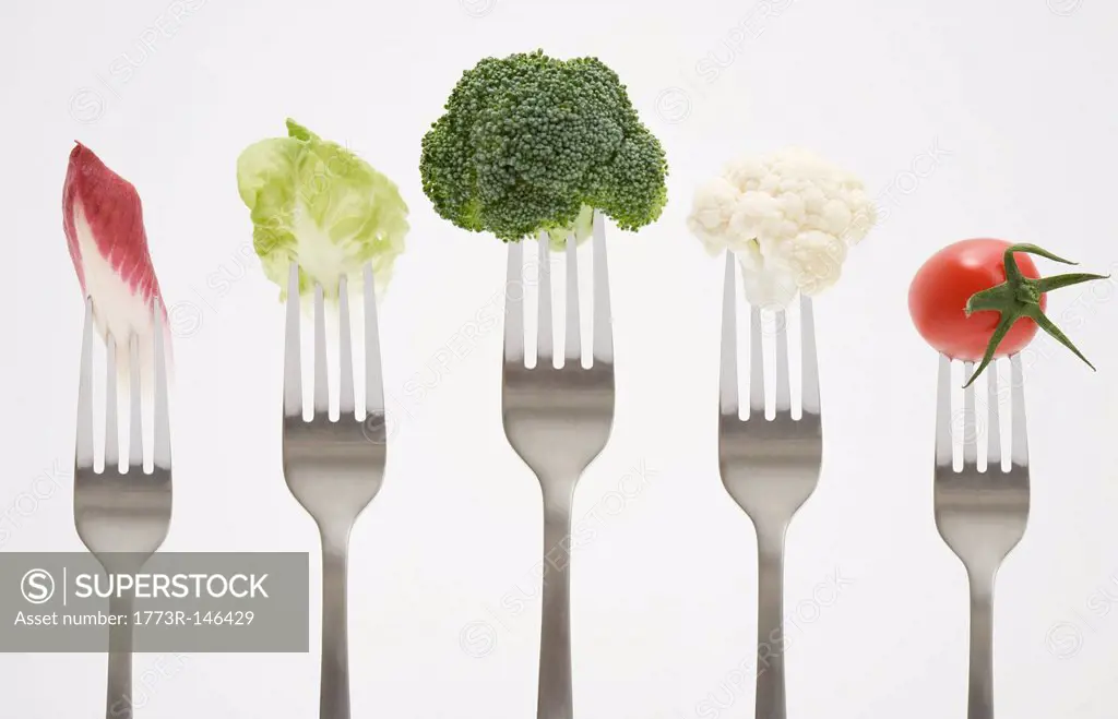 Close up of vegetables on forks