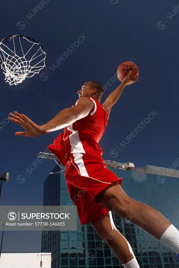 Basketball player about to dunk