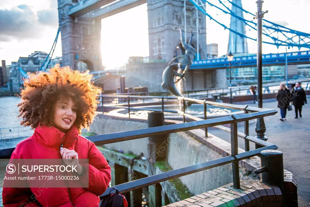 Portrait of young girl, outdoors, Tower Bridge in background, London, England, UK